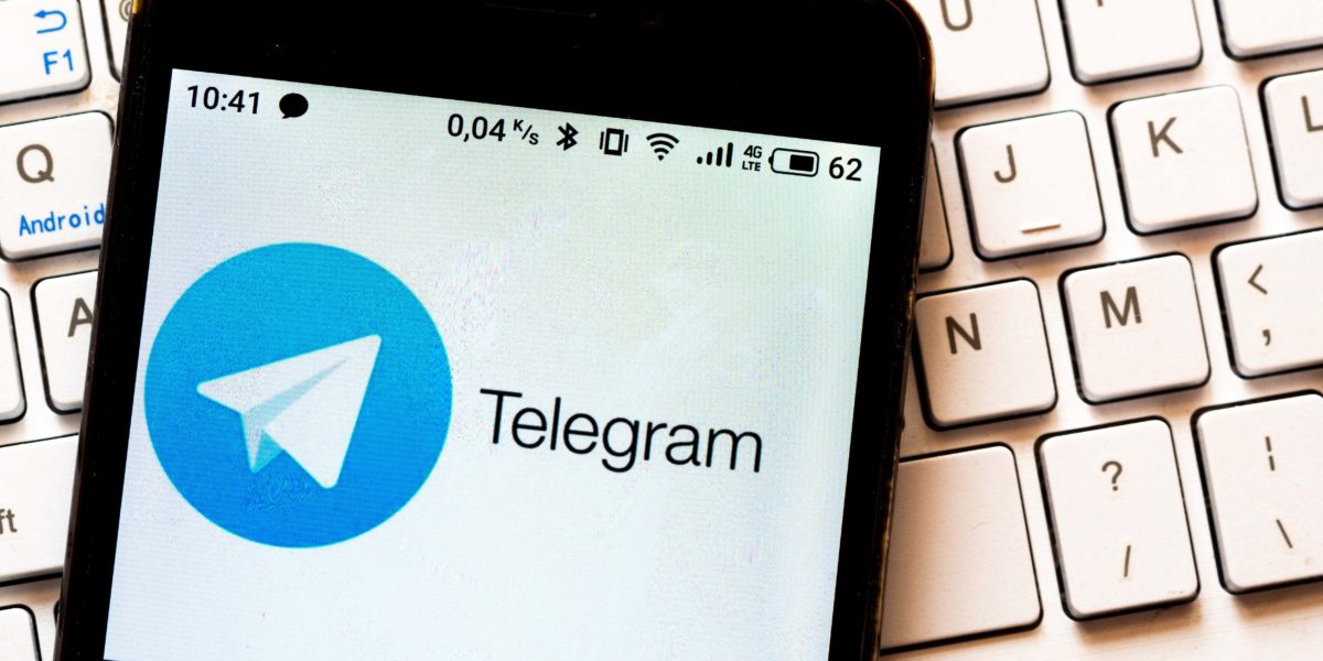 In this photo illustration a Telegram logo is seen displayed