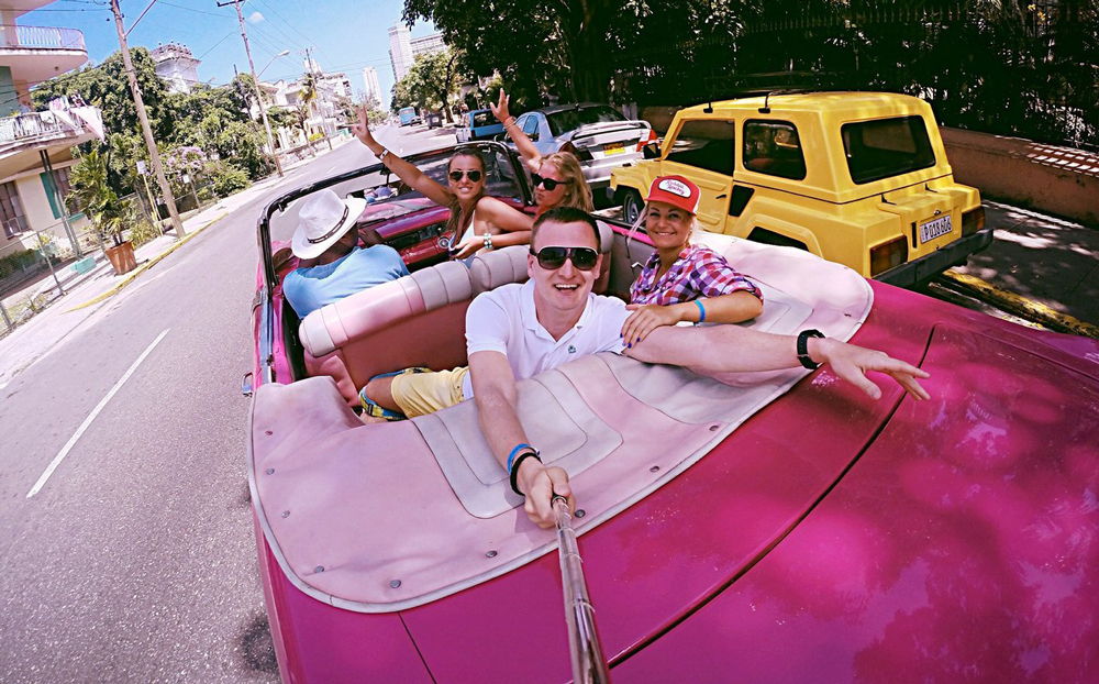 People in a pink car