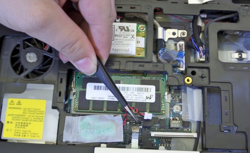 Disconnecting the touchpad power cord from the motherboard