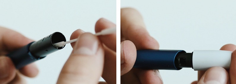 Cleaning the cap with a cotton swab