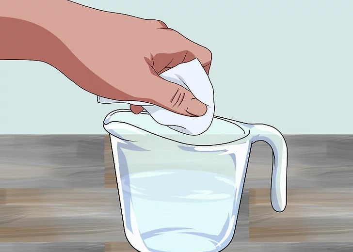 Soaking a rag in a solution