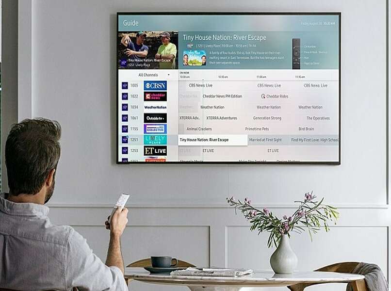 person watching samsung tv plus